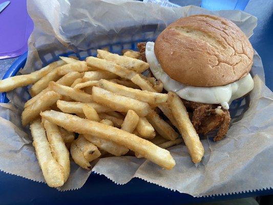 Chicken parm sandwich with fries.