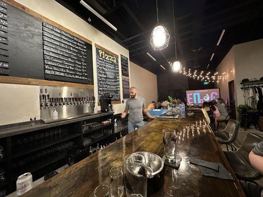 Bar top by the taps.