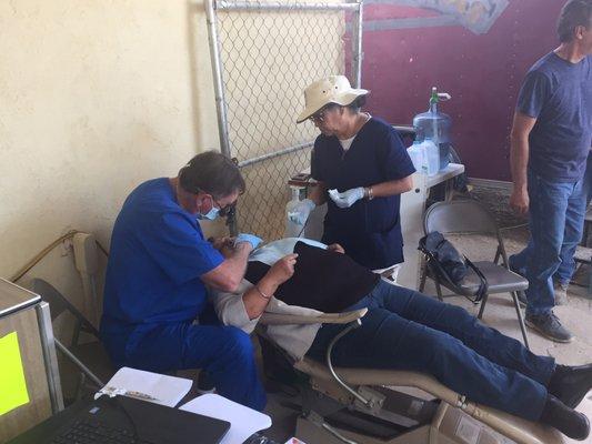 Outdoor dentistry by one of our dentists in Ojos Negros east of Ensenada.