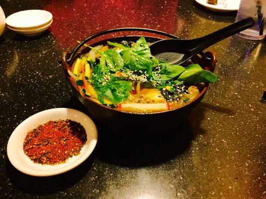 Sukiyaki :) with a side of delicious spicy seasoning that really compliments it and brings everything together.