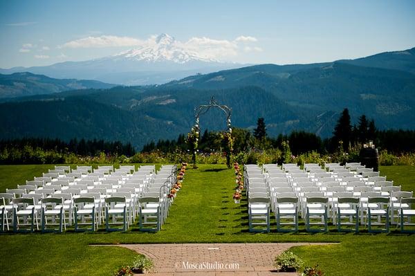 © http://www.moscastudio.com A very beautiful ceremony set up at Gorge Crest Vineyards (July 2013) with vintage iron arch.