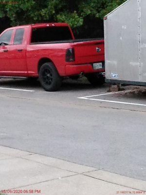 The neighbor trailer that is not supposed to be parked on the property.