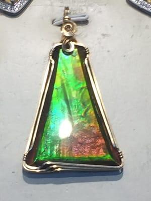 Ammolite wrapped in 14K gold