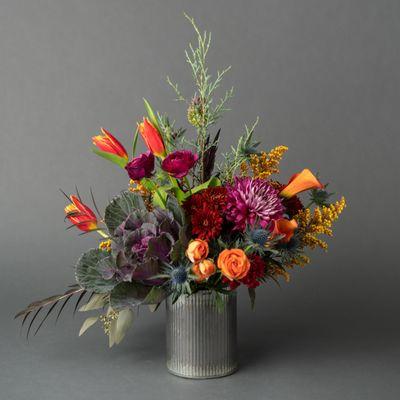 Unique combination of deep jewel toned flowers for a fun Fall birthday gift. Plum purples, vibrant terracotta flowers in a rustic tin vase.