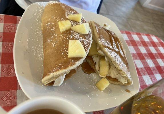 Stuffed pancakes with whipped sweet cream and pineapples. You can choose your filling!