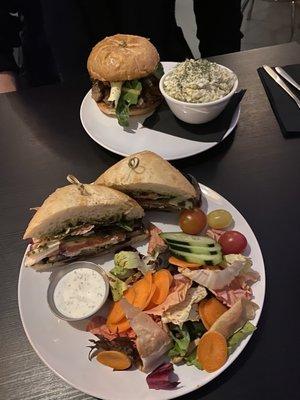 Portobello Sandwich with salad and Brisket Sandwich with potato salad.