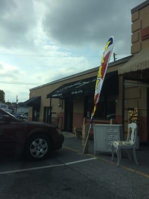 Outside of Jimmy's Barber Shop on a cloudy day