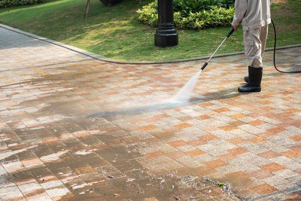 Pressure washing a tile driveway