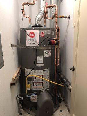 75gal High Efficiency Water heater, Circulating Pump and 2 check valves.