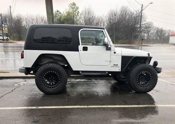 New tires and wheels on Jeep at Robinson Tire Company.