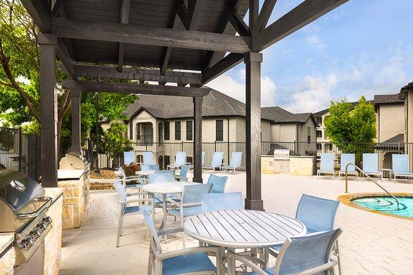 Outdoor built-in kitchen with grilling stations