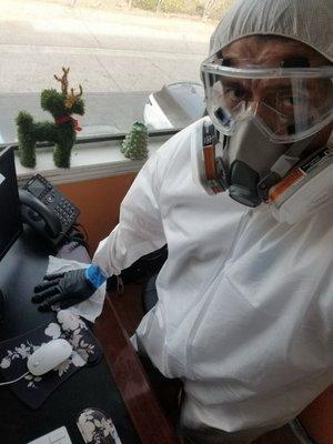 Deep cleaning Office Space from harmful pathogens and wearing the proper PPE gear while doing it.