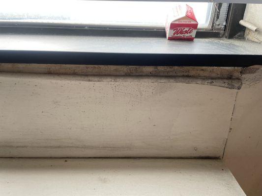 PEELING WALLPAPER BEIND WINDOW SILL WITH MOLD