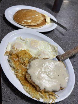 Chicken fried steak, hash browns, eggs over-easy, pancakes I read of toast