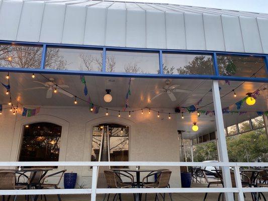 Outdoor patio with a tall heater even!