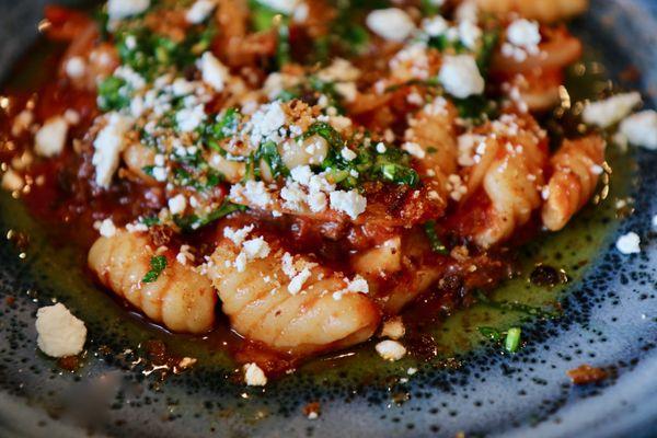 Ricotta Cavatelli with salsa pomodoro, red wine-fennel braised beef, basil gremolata, and ricotta salata.