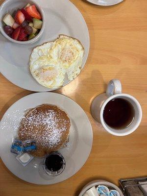 Fruit cup, one pancake, two eggs, hot tea