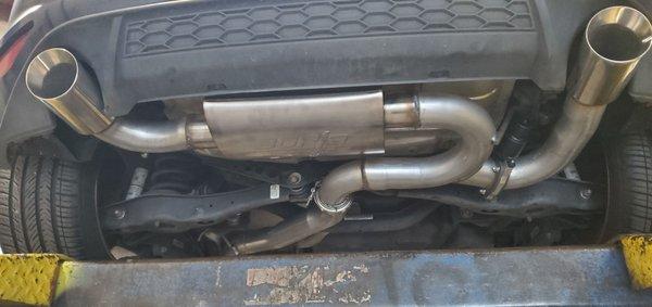 Custom exhaust with muffler, valve, and 4 inch stainless steel tips.