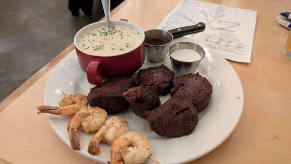 Steak bites with grilled shrimp and clam chowder