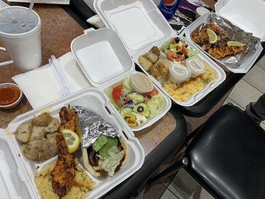 Gyro, kebabs and sides. Rice, salad and potatoes come with each order. So much delicious food !