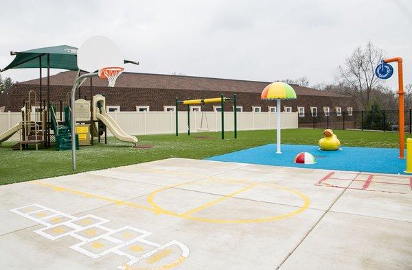 Here's our Pre-K/ Kindergarten playground.  Our splash pad is for all ages to utilize during the warm summer months!