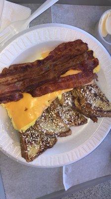 Bacon eggs French toast topped with powdered sugar.  Need I say more?