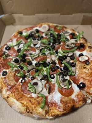 Small pizza with pepperoni, mushroom, green pepper and black olives.