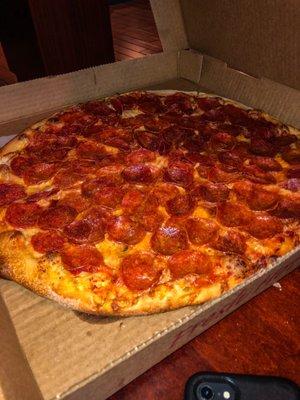 The Large extra pepperoni pizza with light sauce that our son requested we bring home for him.