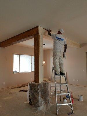 Staining a wood beam