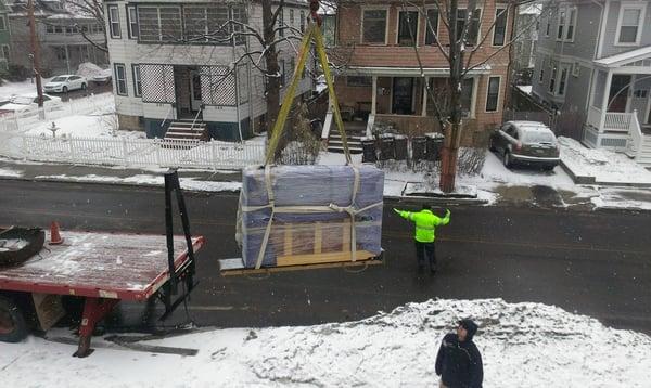 we had to wait for the snow to melt but we finally got this piano craned into its new home