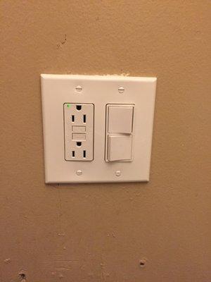 Bathroom light/fan vent switch separation. GFCI's outlet installed as well. New wall plate.