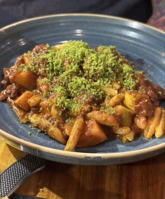 Cavatelli pasta special with persimmon and season bread crumbs