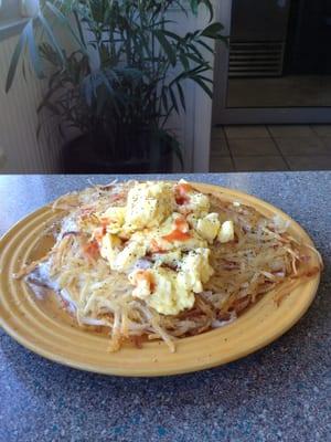 The Big Kahuna 2 Biscuits smothered in gravy topped with golden Hash Browns and 2 eggs