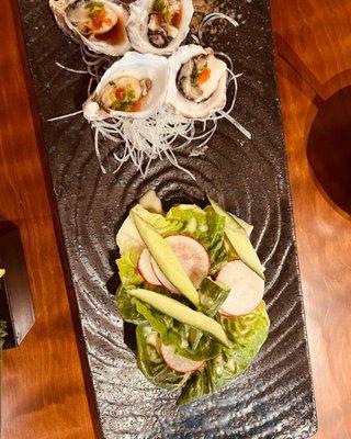 Oysters and a tasty salad with cucumber and radish