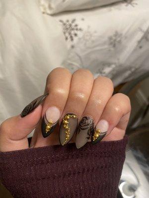 Personally mixed translucent matte gel and glossy black gel with gold rhinestones on acrylics