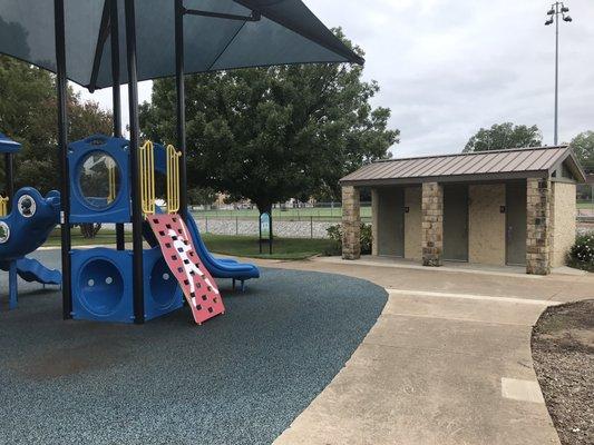 Bathrooms adjacent to play structure