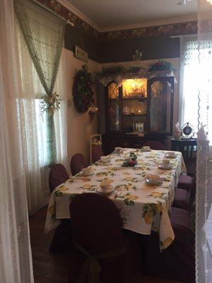 Table for a large party in front room of the house.