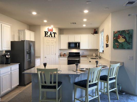 Large spacious kitchen with lots of storage. Large counter enough for 5 chairs.