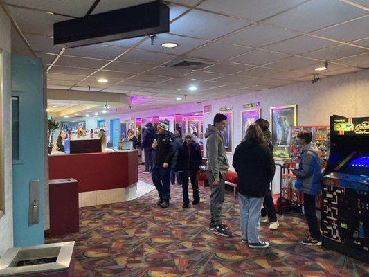 People getting ready to go into the theater from the lobby