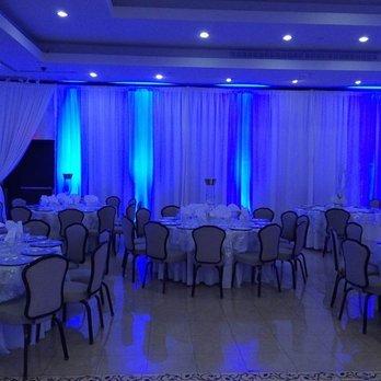 Wedding reception pipe and drape with uplighting.