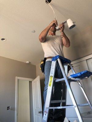 Glo Electric installing Phillips Hue recessed colored lighting.