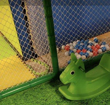 Damaged foam flooring tiles on the soft play toddler area side.