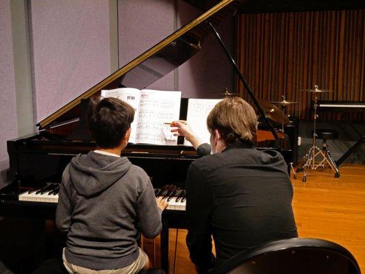 Instructor Nathan Lewis  teaches a private piano lesson