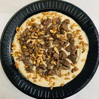 Hummus Topped with Beef, Roasted Almonds and Pine Nuts