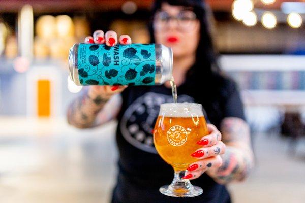 a bartender pours a beer