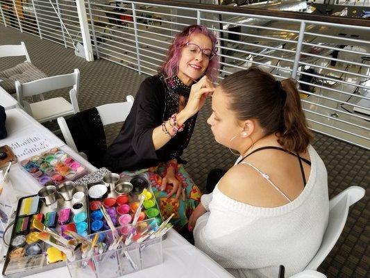 Katy face painting at a private evene3t.