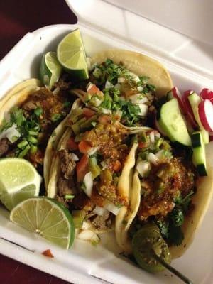 Carne asada tacos topped with your choice of toppings.