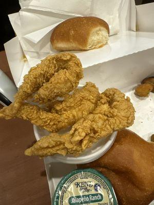 3 chicken tenders should not fit on top of a gravy cup.