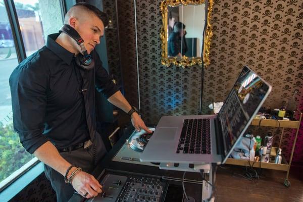 Cut Throat Barbershoppe designer, Darren Natoni, throwing down a live DJ set during the grand opening.