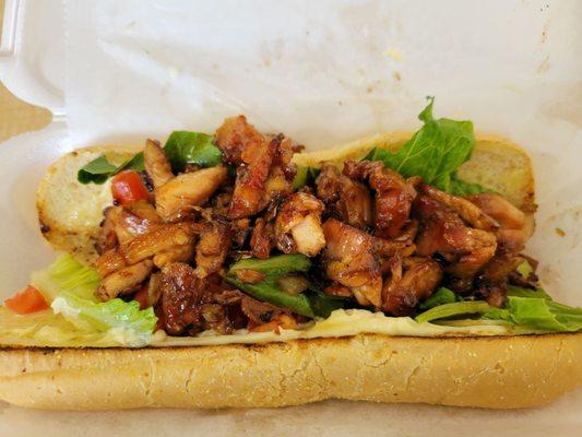 Bourbon chicken sub sandwich.  Mine is without cheese and banana peppers.